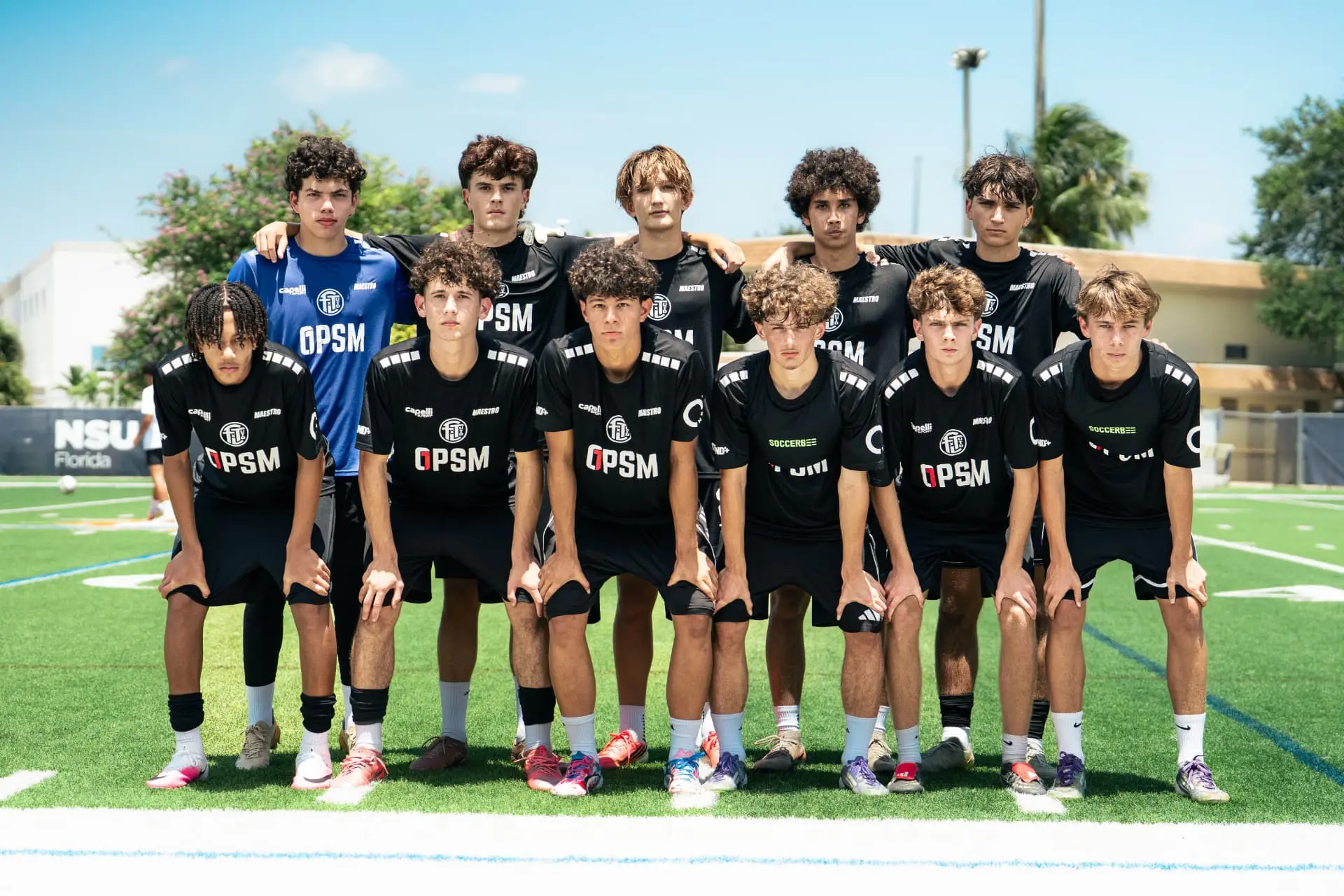 Team photo of the black squad at midfield