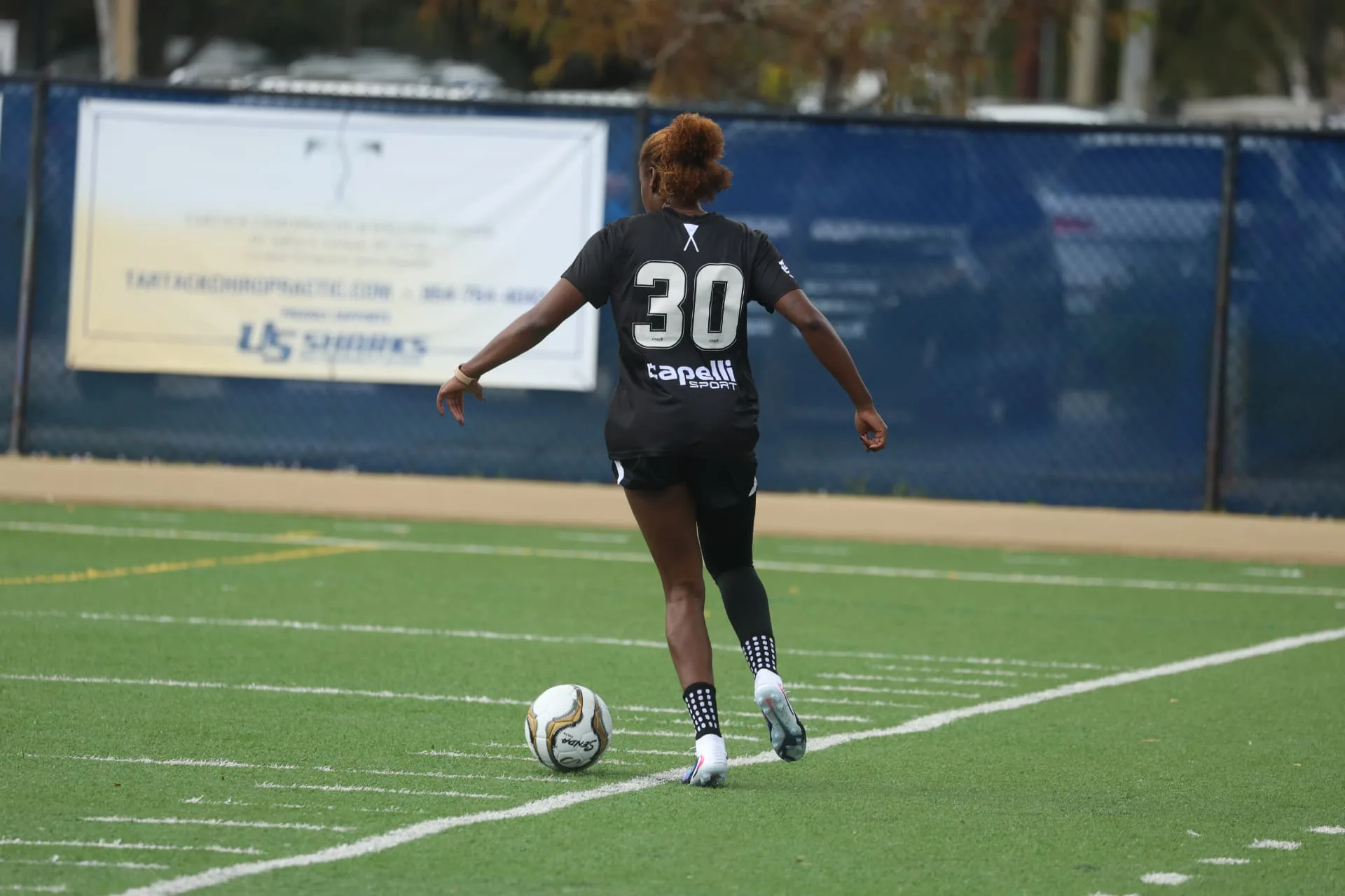 Player preparing to strike the ball on the sideline