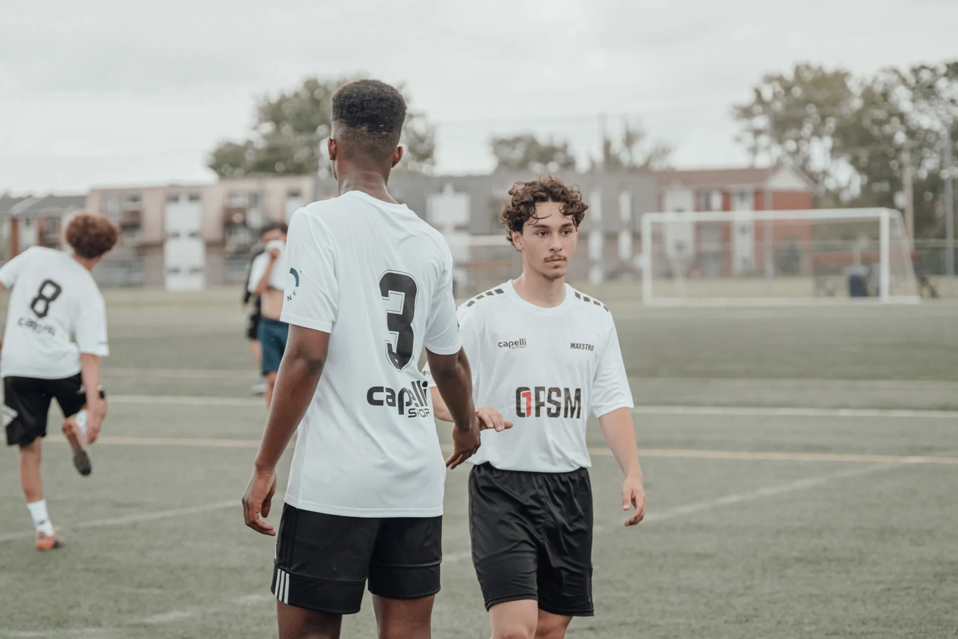 Two players shaking hands at the end of a session