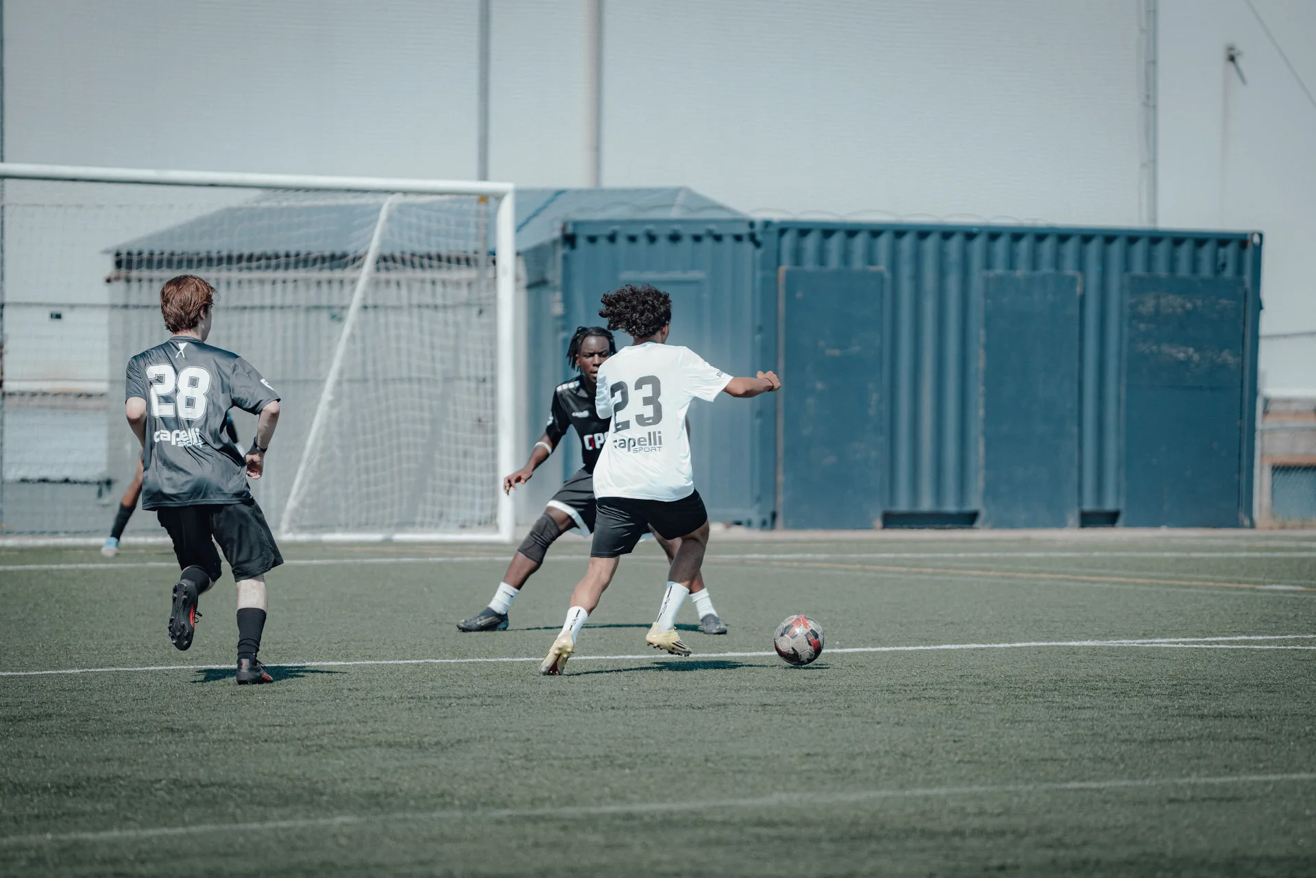 Attacker taking on a defender at the top of the box