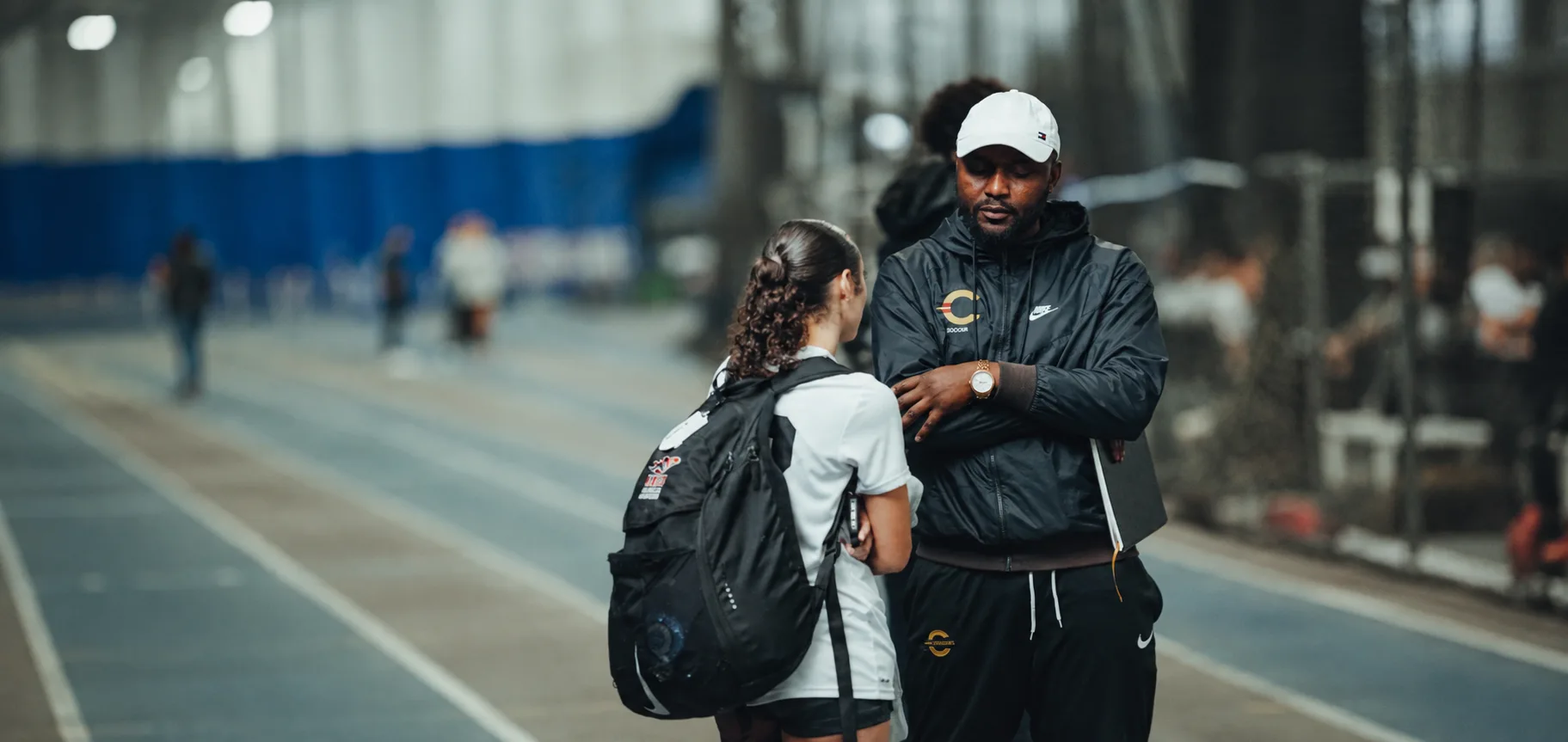 A soccer player in a one-on-one conversation with an advisor
